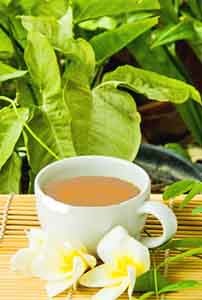 A cup of kava tea on a bamboo mat